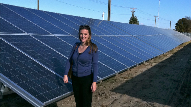 Tess O’Brien in a solar energy field.